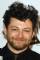 Andy Serkis as Father Carlo
